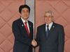 Photograph of Prime Minister Abe shaking hands with President of the Council of the Nation Abdelkader Bensalah of the People's Democratic Republic of Algeria