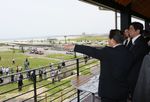 Photograph of the Prime Minister observing the road station (1)