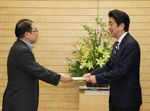 Photograph of the Prime Minister receiving the interim report on the promotion of 