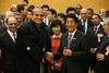 Photograph of Prime Minister Abe shaking hands with Sekitori sumo wrestler Osunaarashi