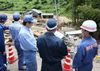 Photograph of the Prime Minister observing a site hit by torrential rain in the Washibara area in Tsuwano Town (1)