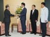 Photograph of Prime Minister Abe receiving the Recommendation from the President of the National Personnel Authority (NPA), Mr. Tsuneo Hara (1)