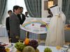 Photograph of the Prime Minister handing over a collection of messages written by people from the disaster-stricken areas at a luncheon hosted by Prime Minister Sheikh Abdullah bin Nasser bin Khalifa Al Thani