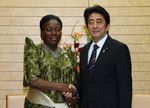 Photograph of Prime Minister Abe shaking hands with Rt. Hon. Rebecca Alitwala Kadaga, Speaker of Parliament of the Republic of Uganda
