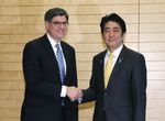 Photograph of Prime Minister Abe shaking hands with the Hon. Jacob J. Lew, Secretary of the Treasury of the United States of America