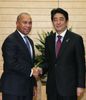 Photograph of Prime Minister Abe shaking hands with the Hon. Deval L. Patrick, Governor of the Commonwealth of Massachusetts