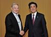 Photograph of Prime Minister Abe shaking hands with Mr. George Soros