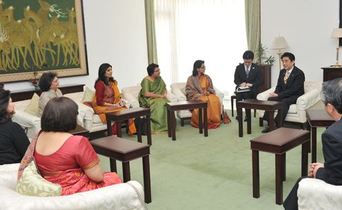 Photograph of the Prime Minister conversing with women leaders