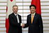 Photograph of Prime Minister Abe shaking hands with H.E. Mr. Didier Burkhalter, President of the Swiss Confederation