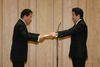 Photograph of Prime Minister Abe presenting Mr. Ryotaro Sugi with the Prime Minister's certificate of appreciation