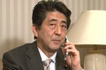 Photograph of Prime Minister Abe making the congratulatory telephone call to Paralympic team member Mr. Akira Kano