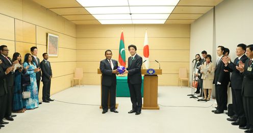 Photograph of the Prime Minister presenting a football (2)