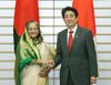 Photograph of Prime Minister Abe shaking hands with H.E. Sheikh Hasina, Prime Minister of the People's Republic of Bangladesh