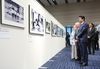 Photograph of the Prime Minister viewing photos with the guidance of Mr. Shigeru Yokota and his wife (2)
