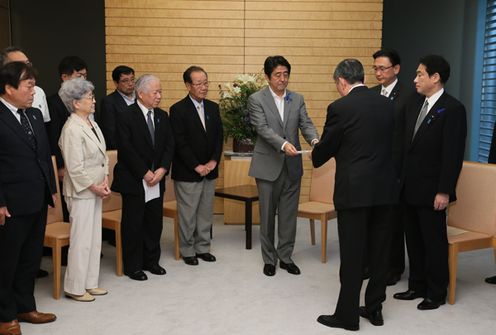 Photograph of the Prime Minister receiving a letter of request