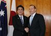 Photograph of Prime Minister Abe shaking hands with the Prime Minister of Australia