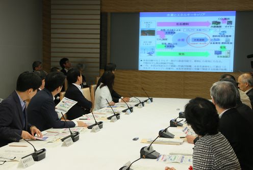 Photograph of the Prime Minister listening to the presentation