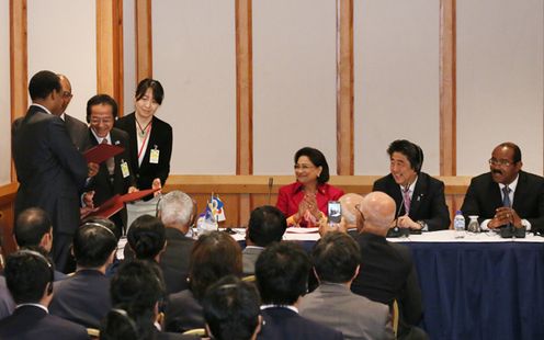 Photograph of the Prime Minister attending the signing ceremony