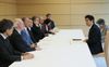 Photograph of the Prime Minister meeting with Mr. Sasakawa, Chairman of The Nippon Foundation, and international experts on radiation health management