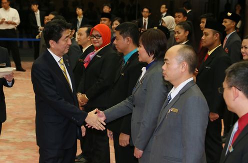 Photograph of the Prime Minister shaking hands with the representatives
