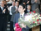 Photograph of the Prime Minister receiving a bouquet from staff at the Prime Minister's Official Residence