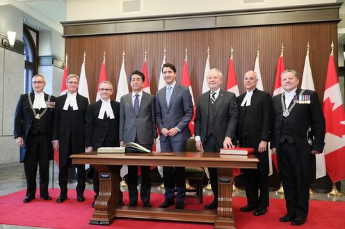 Photograph of the Prime Minister signing a book prior to the summit meeting (2)