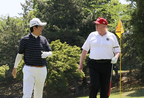 Photograph of the leaders playing golf (1)