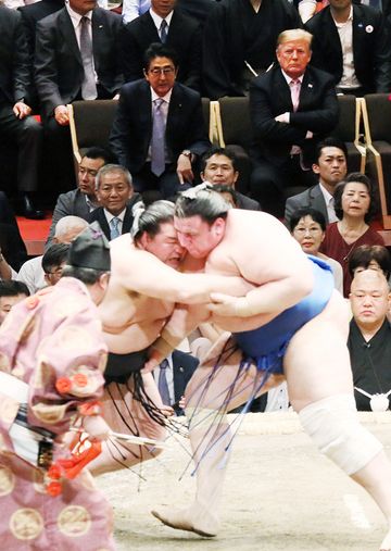 Photograph of the leaders watching the grand sumo tournament