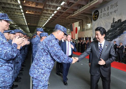 Photograph of the Prime Minister shaking hands with the personnel