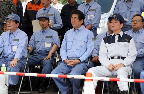 Photograph of the Prime Minister observing a marine drill