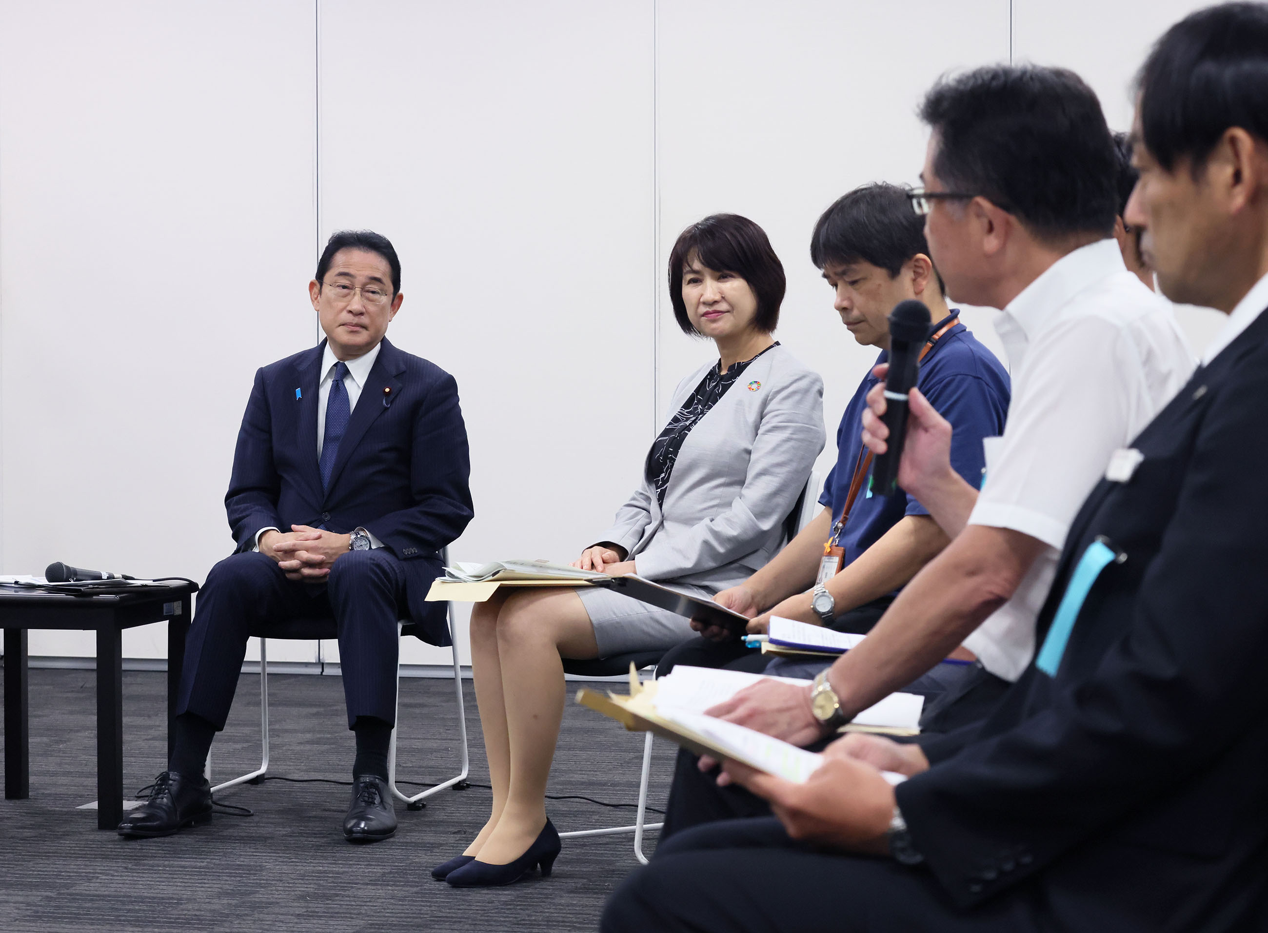 Prime Minister Kishida listening to other participants in an exchange of views