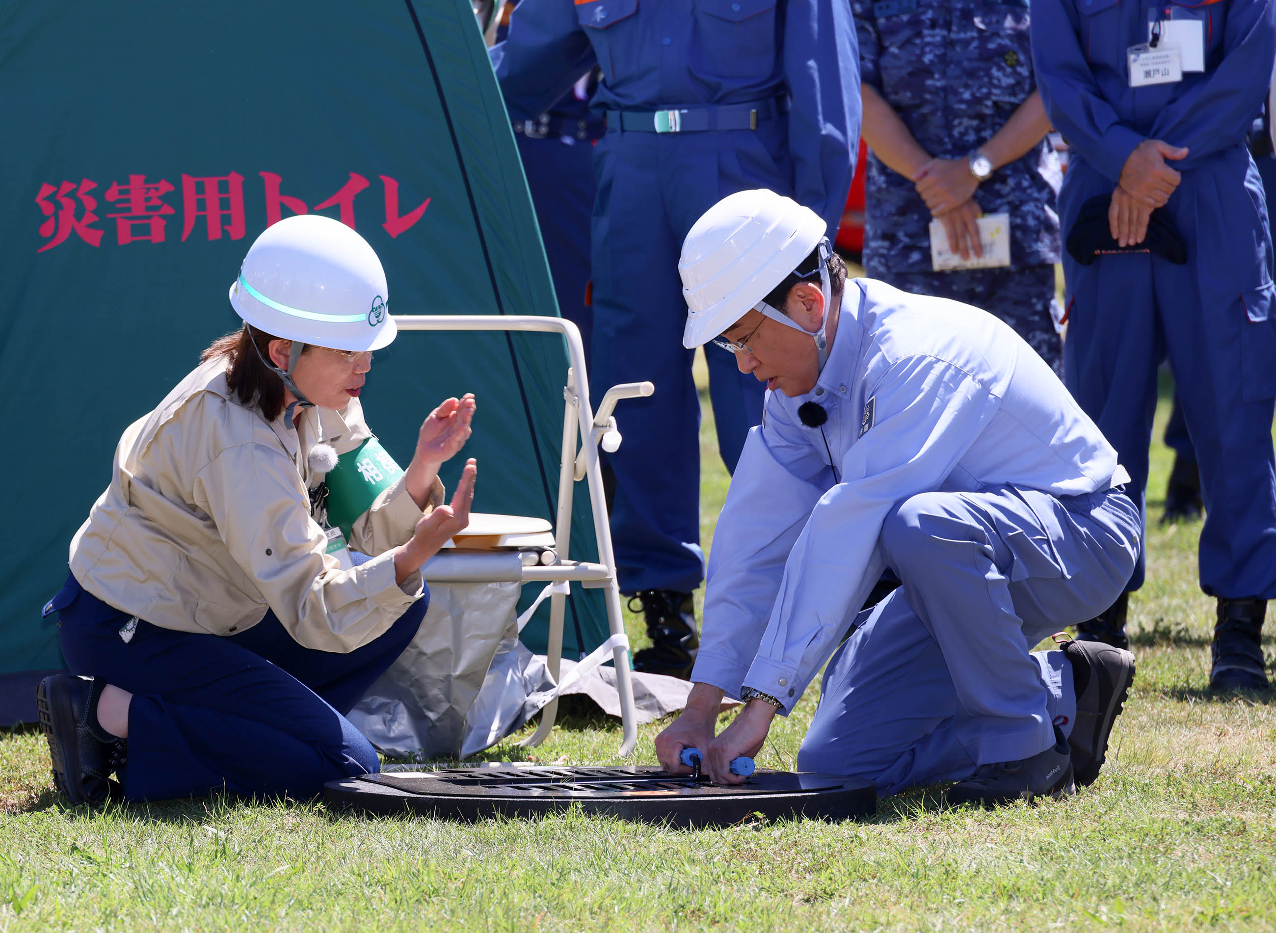 Prime Minister Kishida installing a utility whole toilet (1)