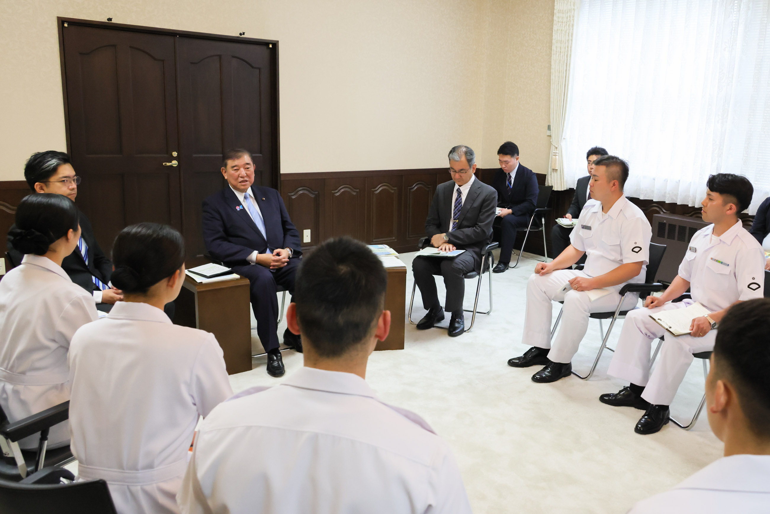 Prime Minister Ishiba holding a small group talk with the JMSDF personnel from the Maizuru Training Center(4)