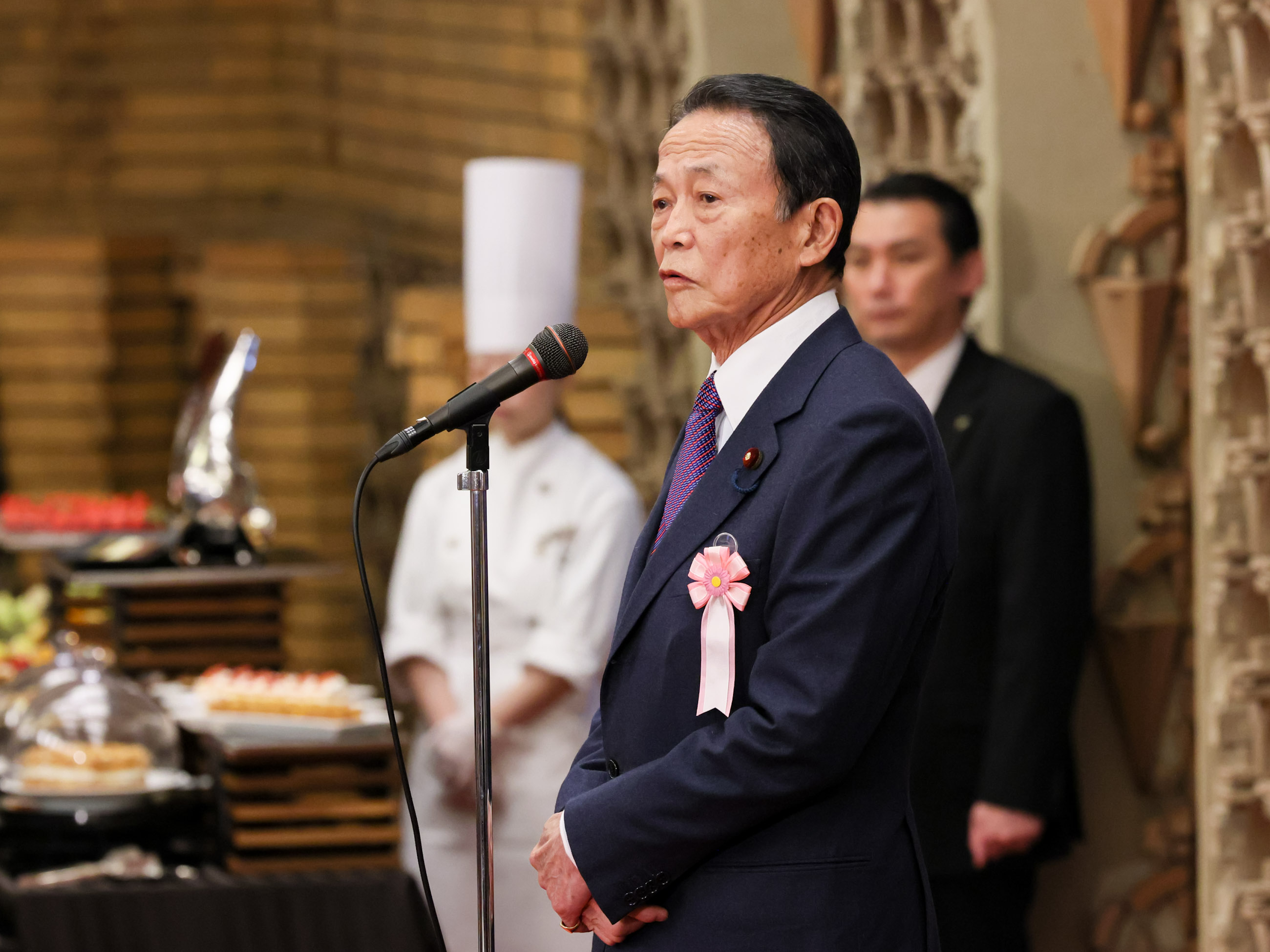 Former Prime Minister Aso making a toast (1)