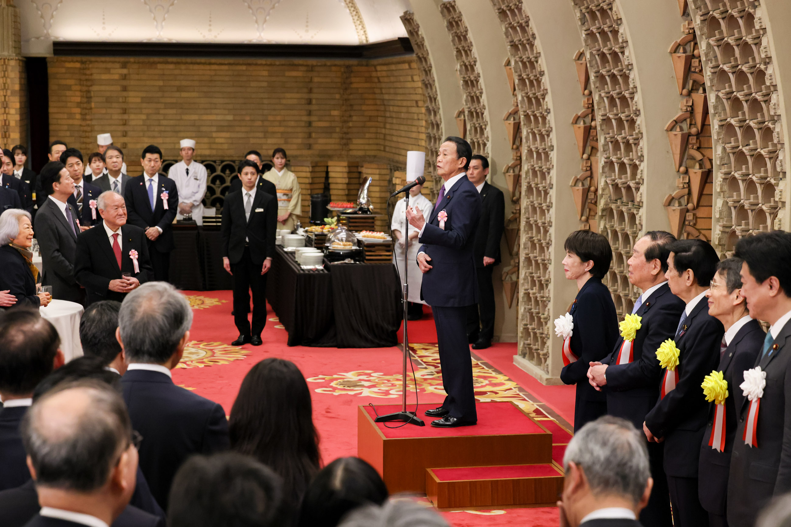 Former Prime Minister Aso making a toast (2)