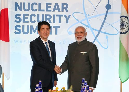 Photograph of the Prime Minister shaking hands with the Prime Minister of India