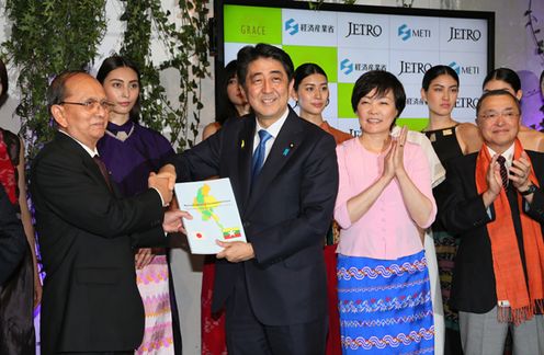 Photograph of the leaders exchanging the “Vision for Industrial Development in Myanmar” report