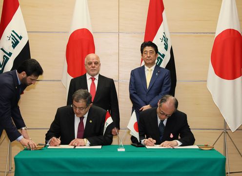 Photograph of the leaders attending the signing ceremony