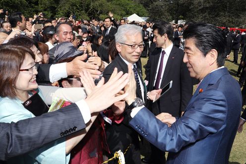 Photograph of the Prime Minister conversing with guests