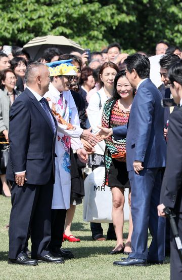 Photograph of the Prime Minister conversing with guests