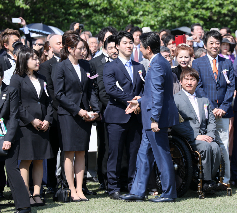 Photograph of the Prime Minister conversing with guests