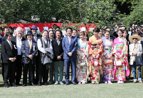 Photograph of the Prime Minister having a photograph taken with guests