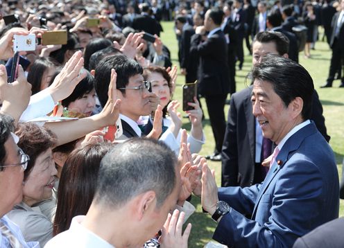 Photograph of the Prime Minister conversing with guests