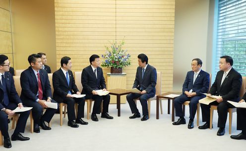 Photograph of the Prime Minister receiving the report