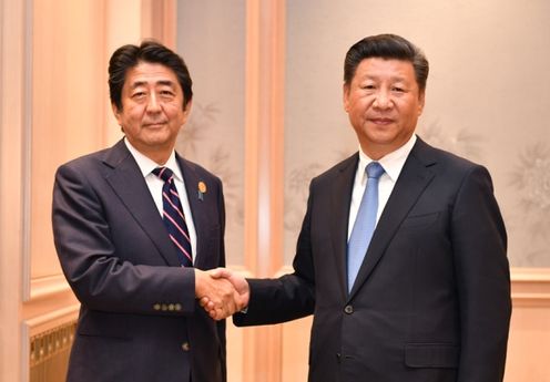 Photograph of the Prime Minister shaking hands with the President of China (Pool Photo)