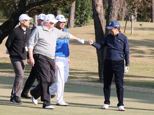 Photograph of the leaders playing golf (1)