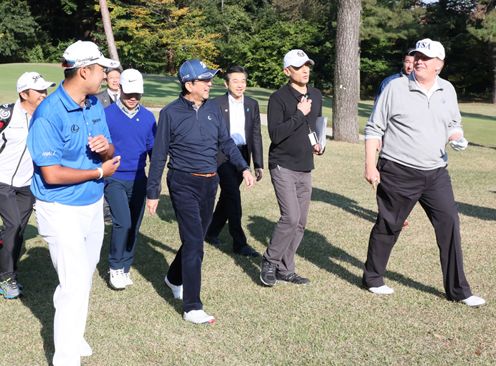 Photograph of the leaders playing golf (2)