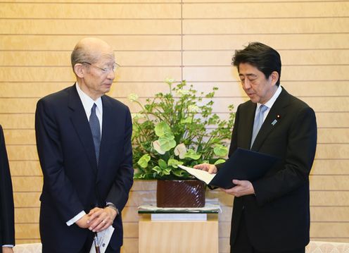 Photograph of the Prime Minister being presented with the report (2)