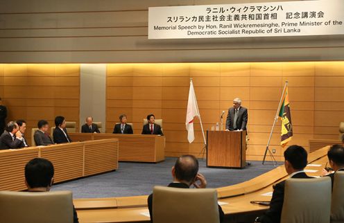 Photograph of the Prime Minister listening to the lecture