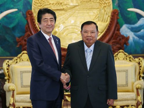 Photograph of Prime Minister Abe shaking hands with the President of Laos